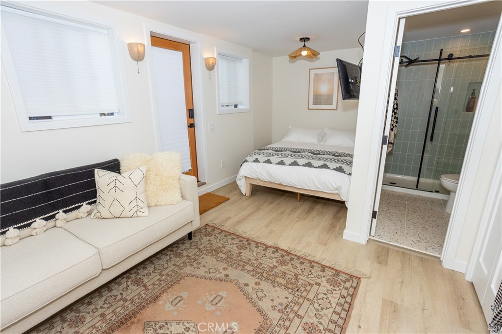 160 Avenida Florencia, Unit C San Clemente, CA 92672 - Photo 8 of 10 a bedroom with a bed and a large window