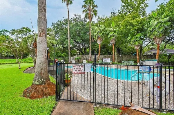 a view of a wrought iron fences in front of house