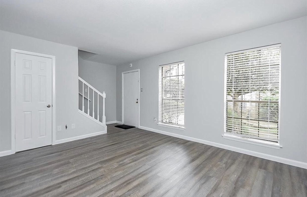 5100 Allendale Road, Unit 306 Houston, TX 77017 - Photo 3 of 13 a view of an empty room with wooden floor and a window