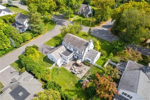 an aerial view of a house with a garden