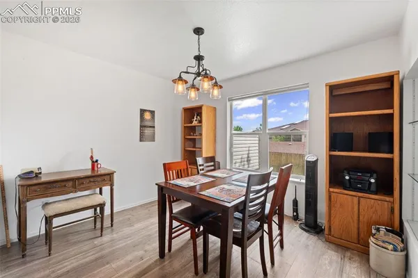 a dining room with furniture and window