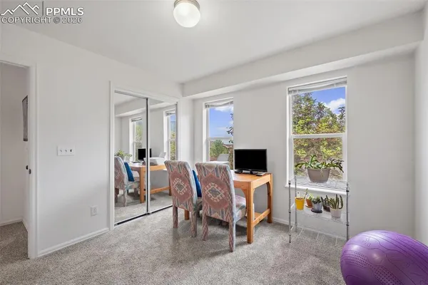 a view of a livingroom with furniture and a window