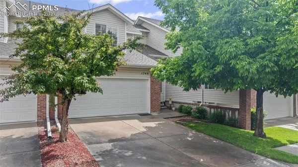 a house with trees in front of it