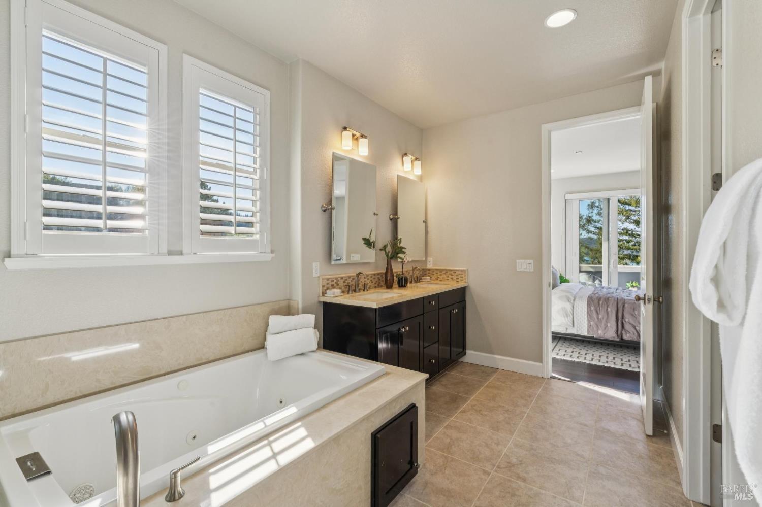 9 Edgehill Way San Rafael, CA 94903 - Photo 50 of 69 a spacious bathroom with a bathtub sink and mirror
