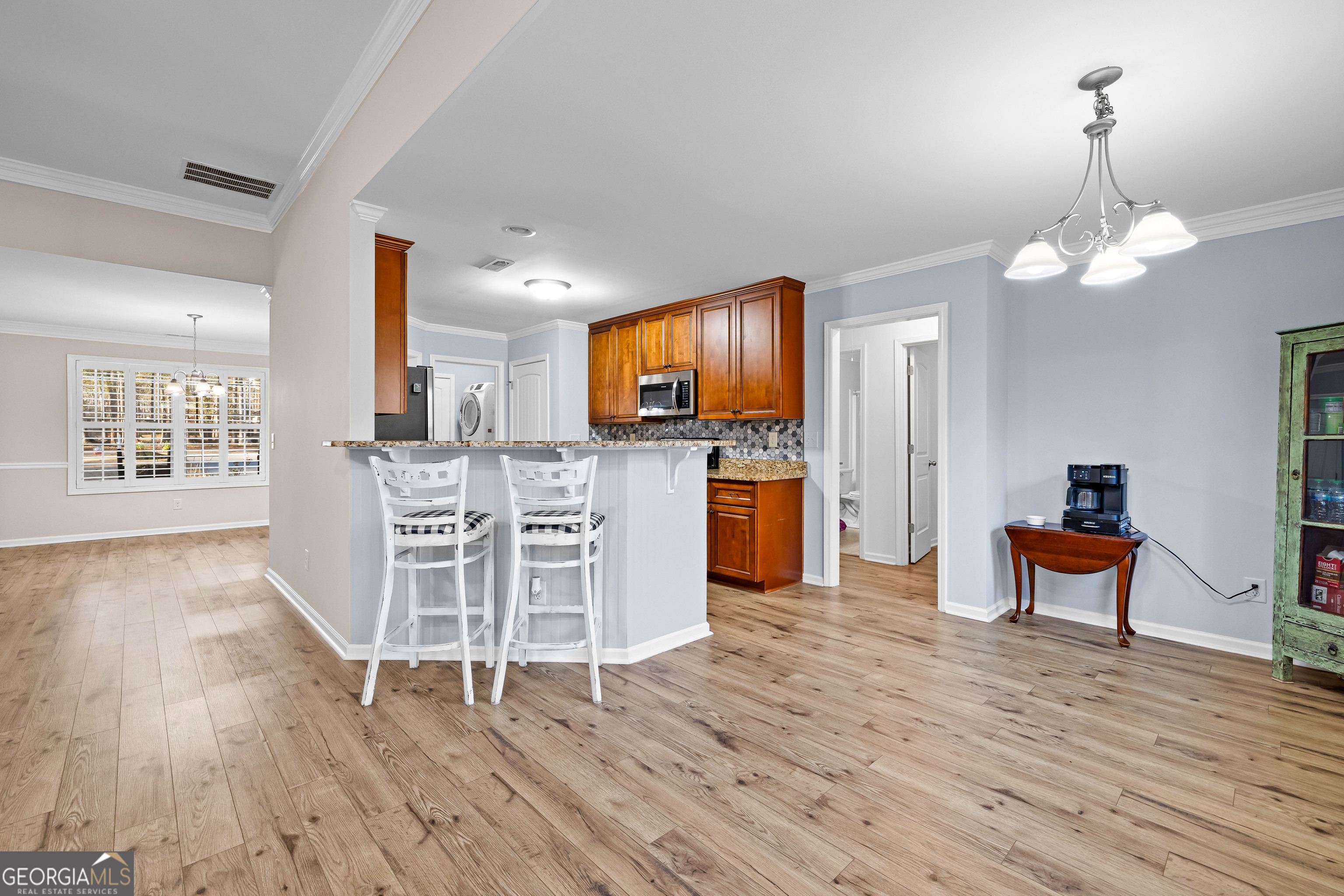 4 Buttonbush Court Newnan, GA 30265 - Photo 11 of 40 a view of a kitchen with furniture wooden floor and window