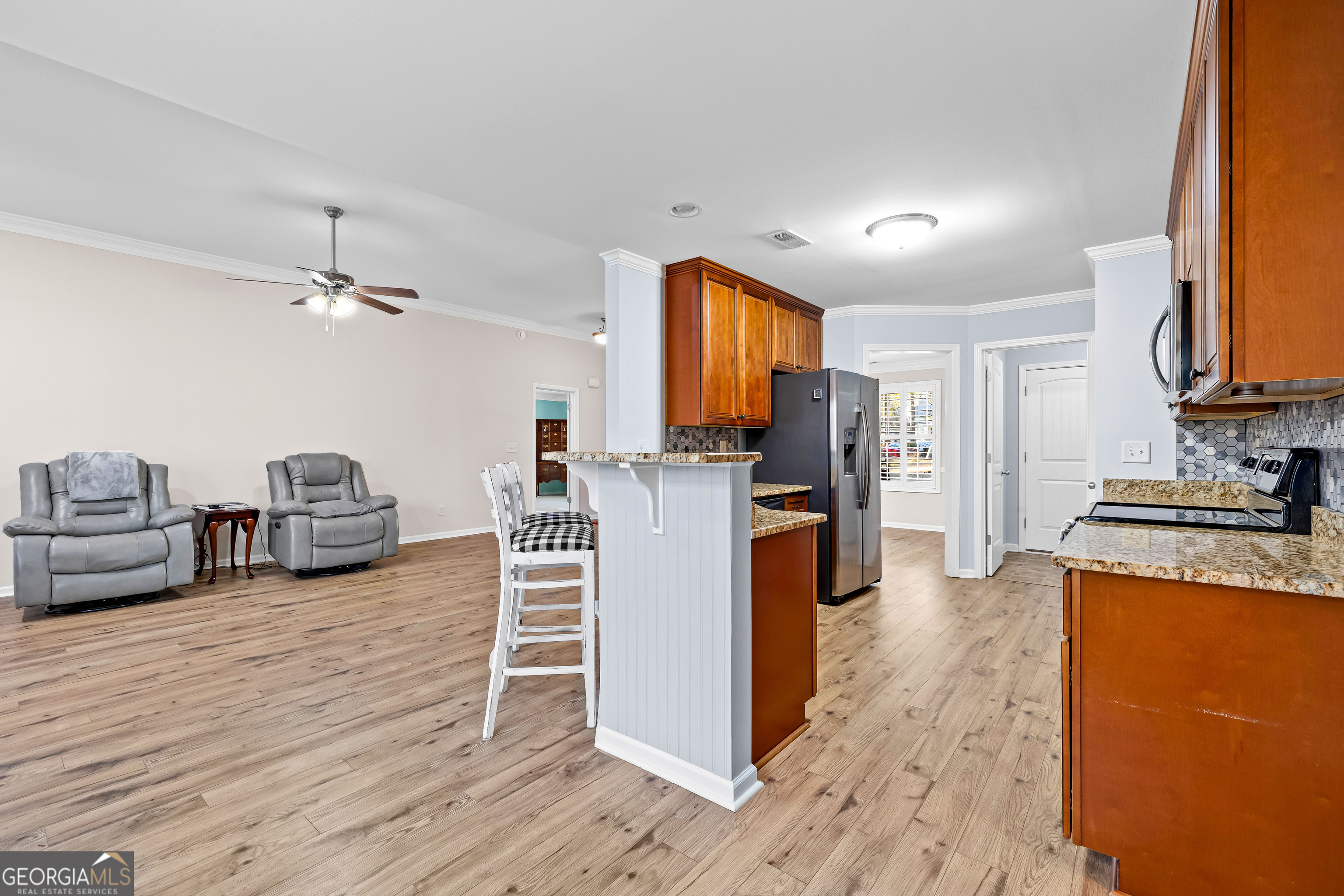 4 Buttonbush Court Newnan, GA 30265 - Photo 14 of 40 a kitchen with furniture and a wooden floor