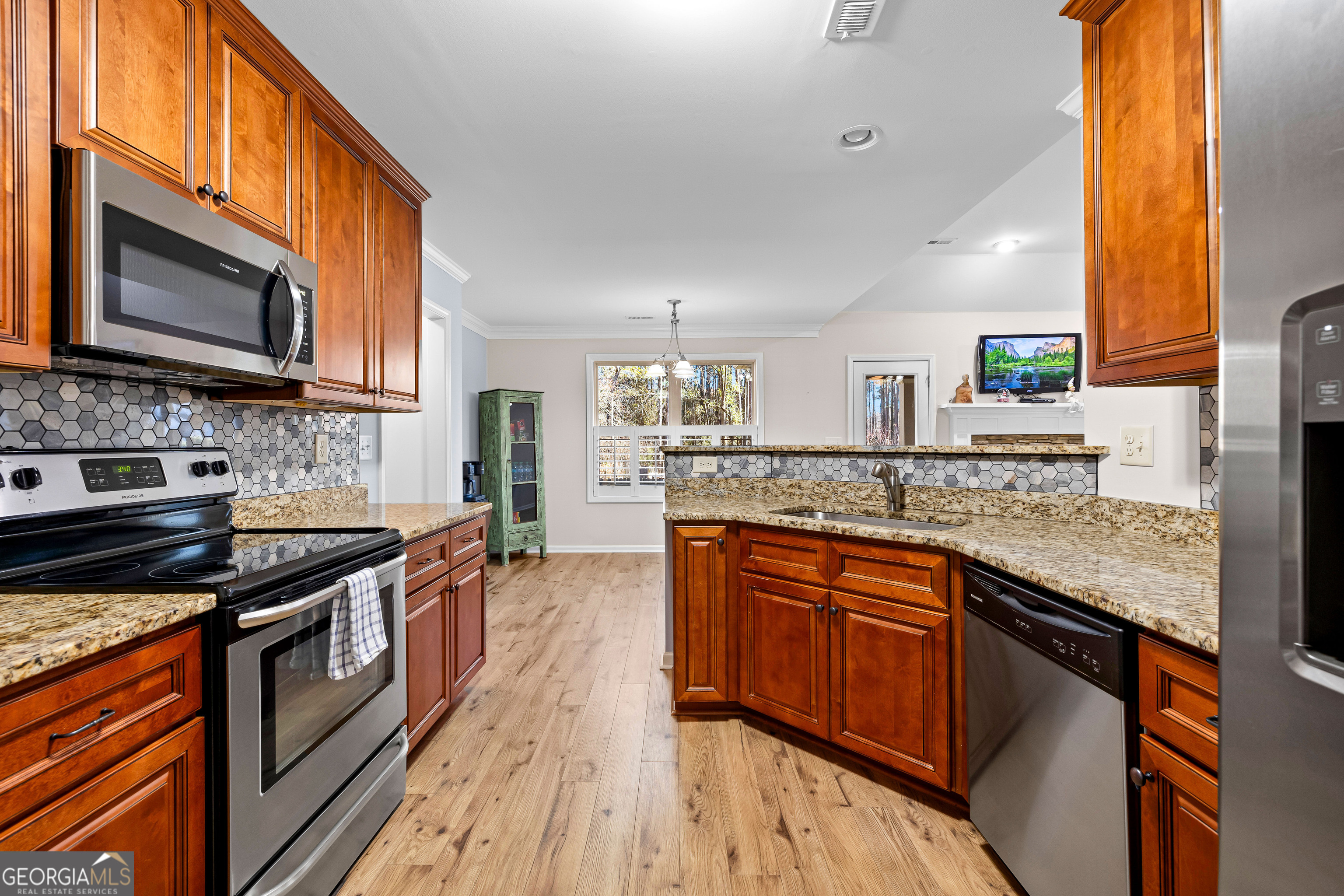 4 Buttonbush Court Newnan, GA 30265 - Photo 15 of 40 a kitchen with stainless steel appliances granite countertop a stove a sink and a microwave