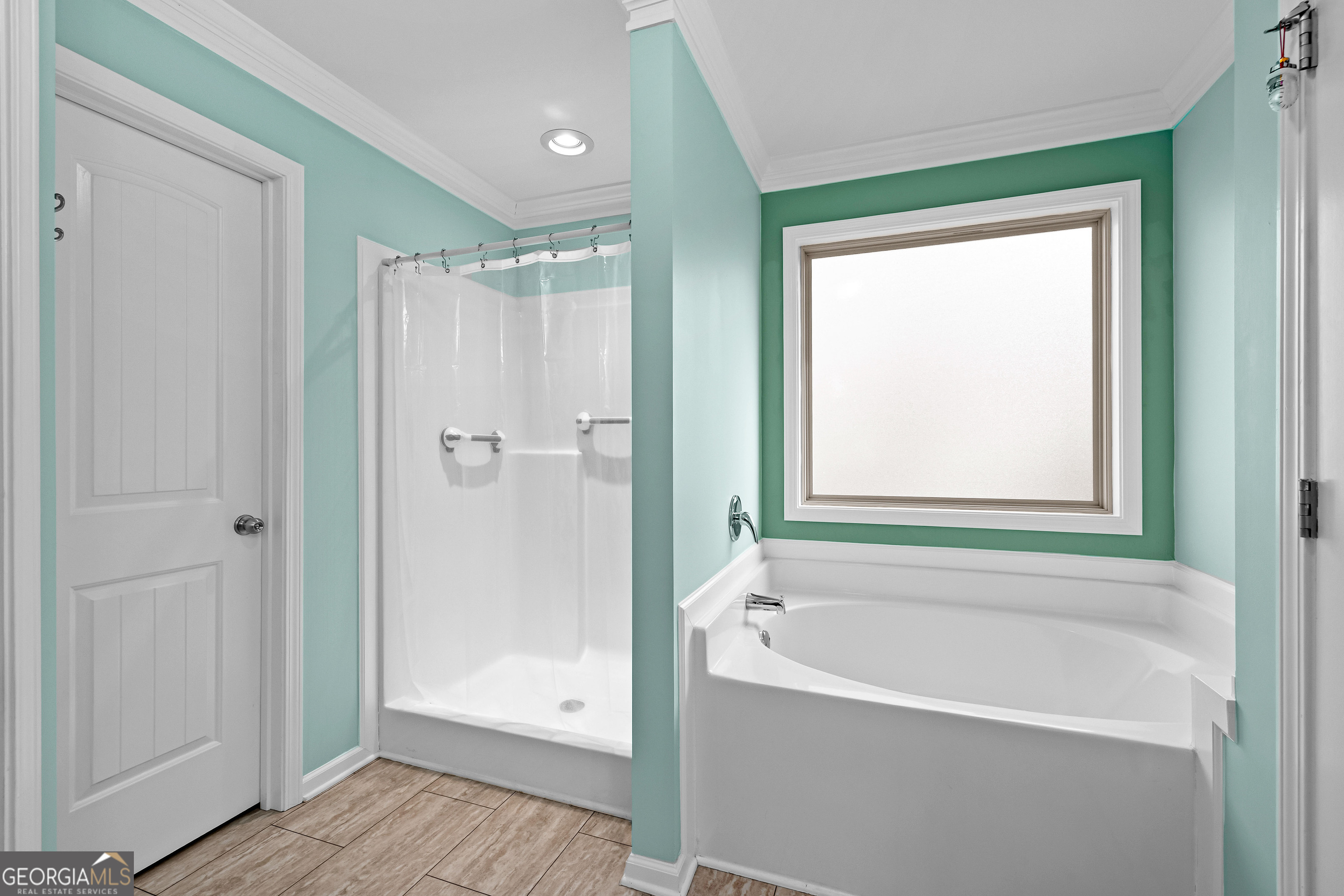 4 Buttonbush Court Newnan, GA 30265 - Photo 24 of 40 a bathroom with a bathtub shower and a sink