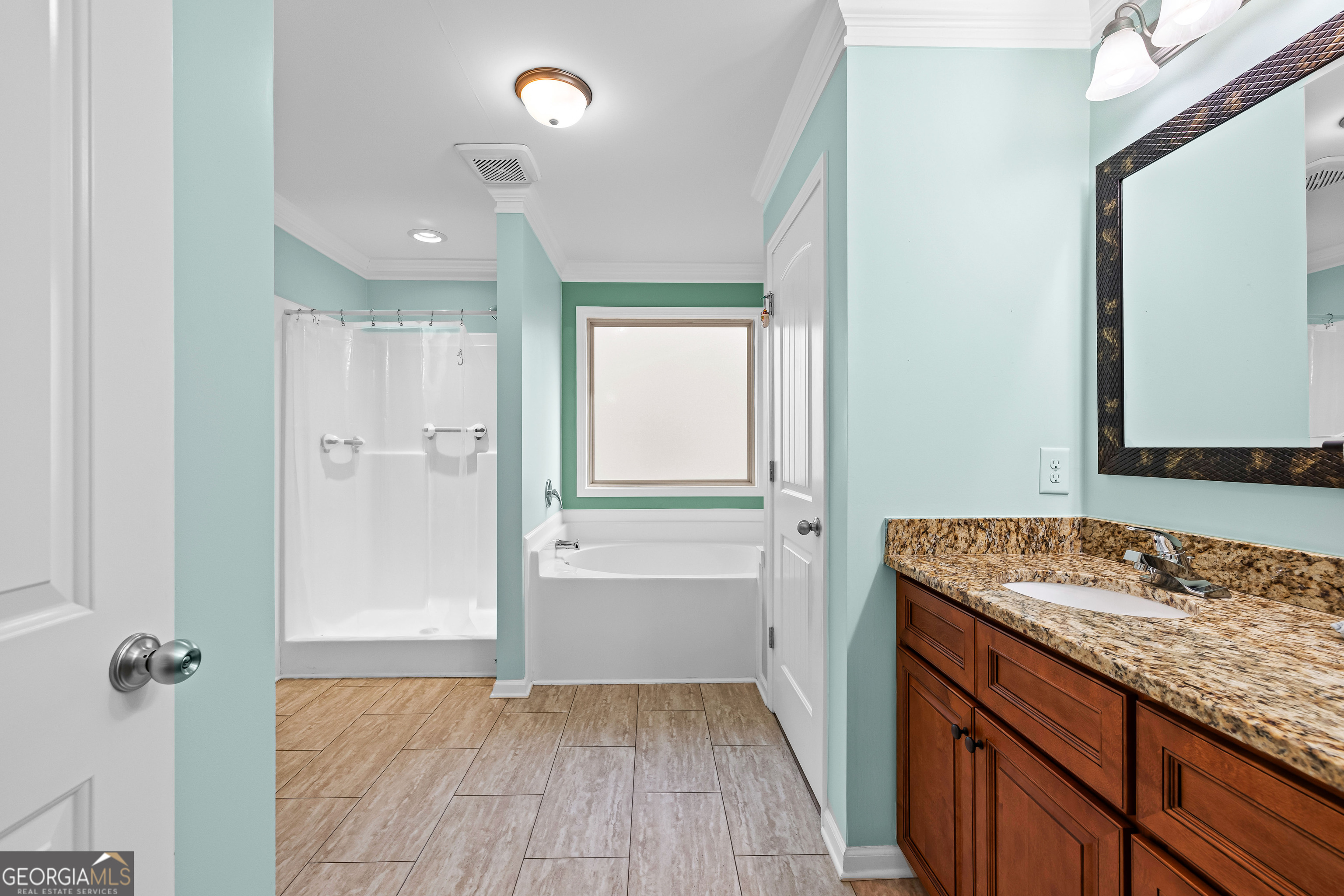 4 Buttonbush Court Newnan, GA 30265 - Photo 25 of 40 a bathroom with a granite countertop sink and a mirror