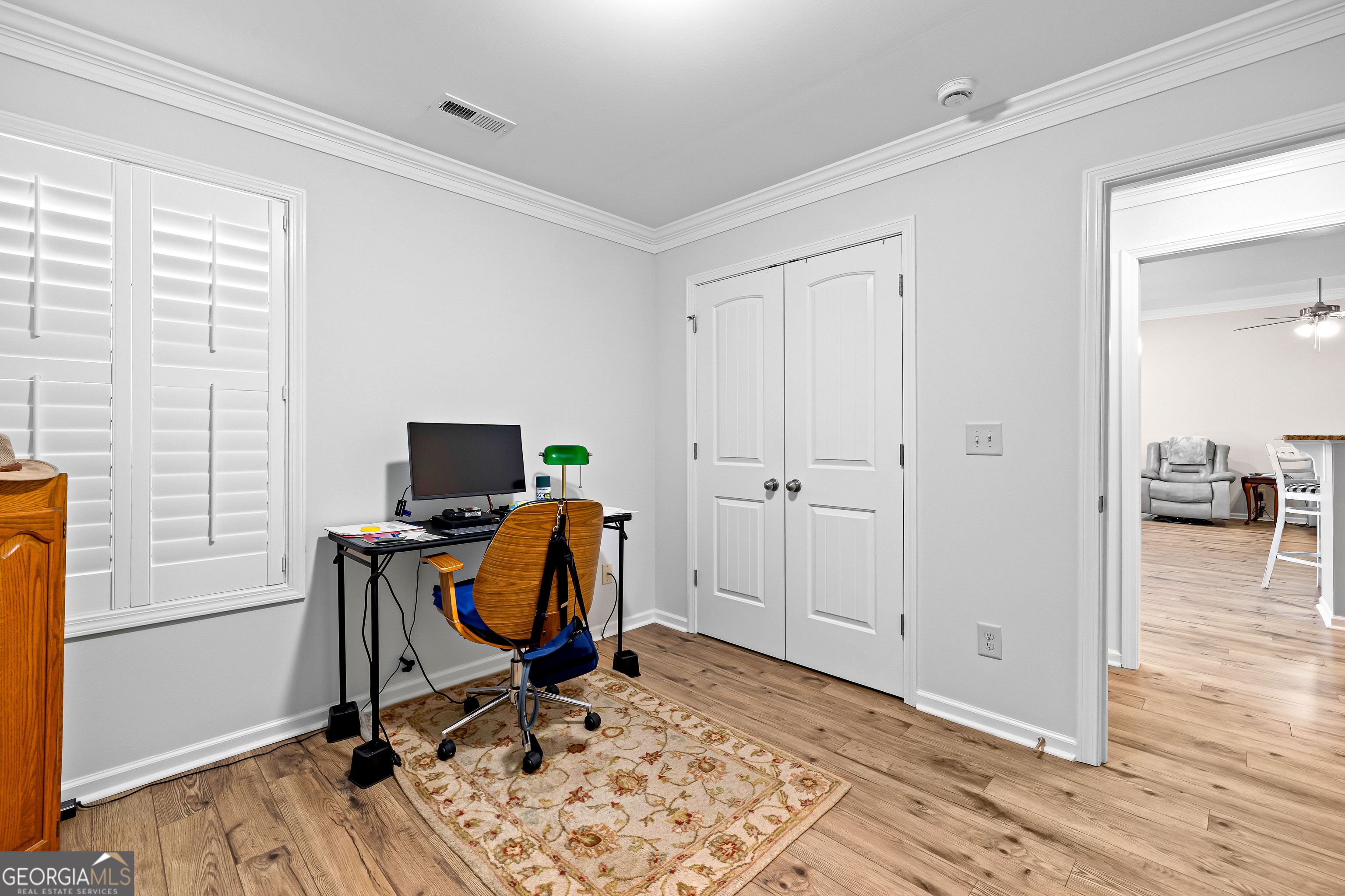 4 Buttonbush Court Newnan, GA 30265 - Photo 31 of 40 a view of a workspace with furniture and wooden floor