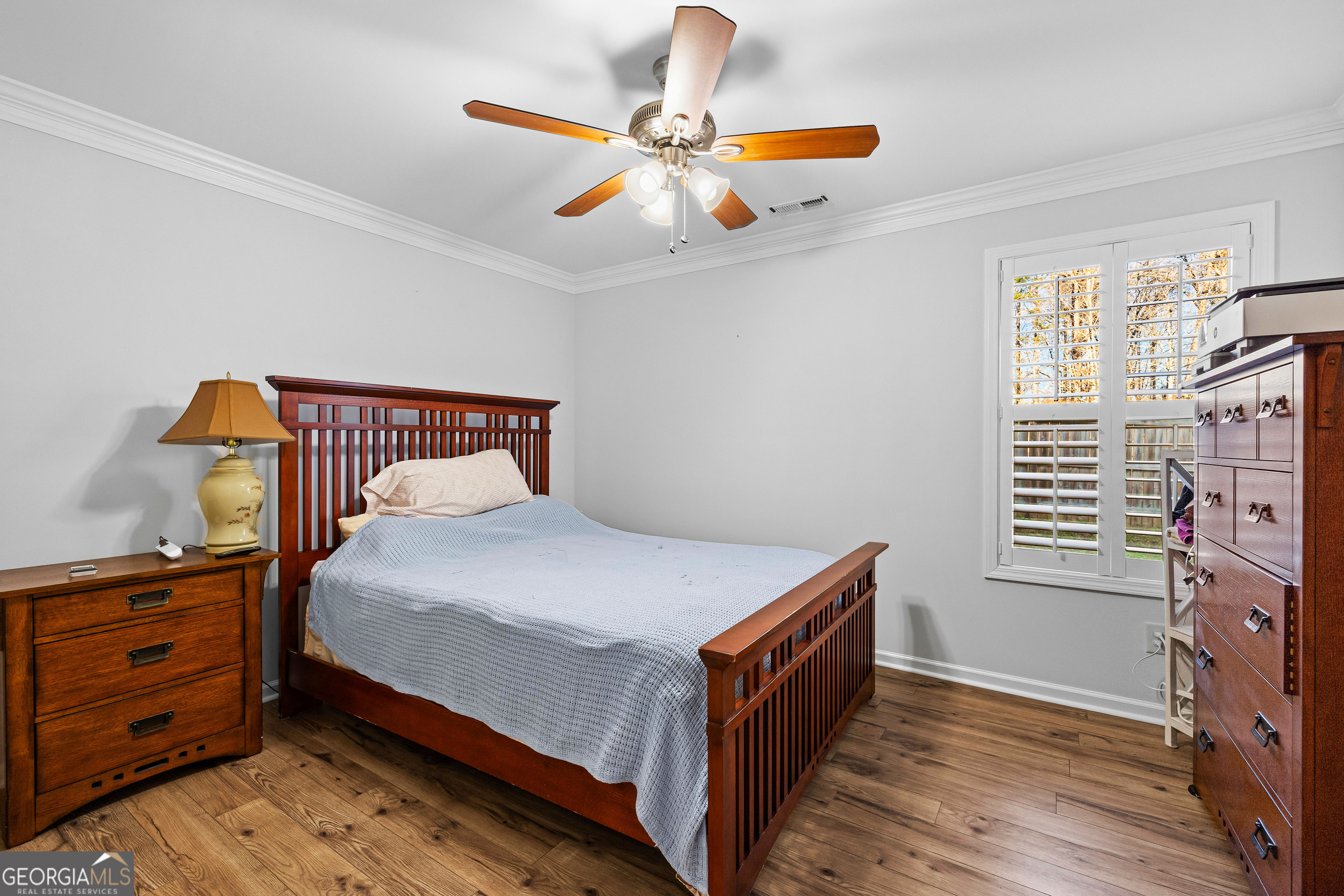 4 Buttonbush Court Newnan, GA 30265 - Photo 33 of 40 a bedroom with a bed and a chandelier