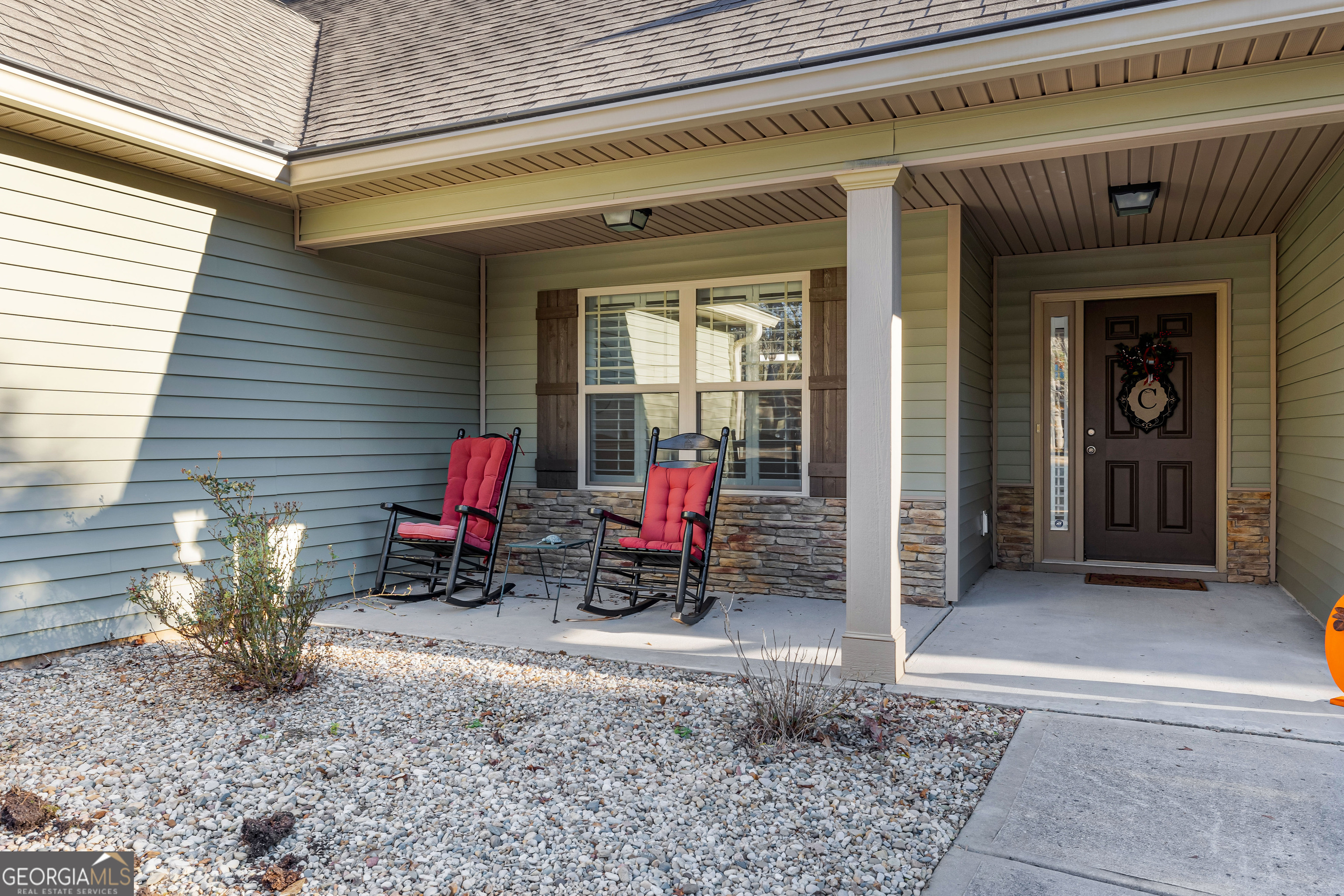 4 Buttonbush Court Newnan, GA 30265 - Photo 4 of 40 a view of a room with a table and chairs and potted plants