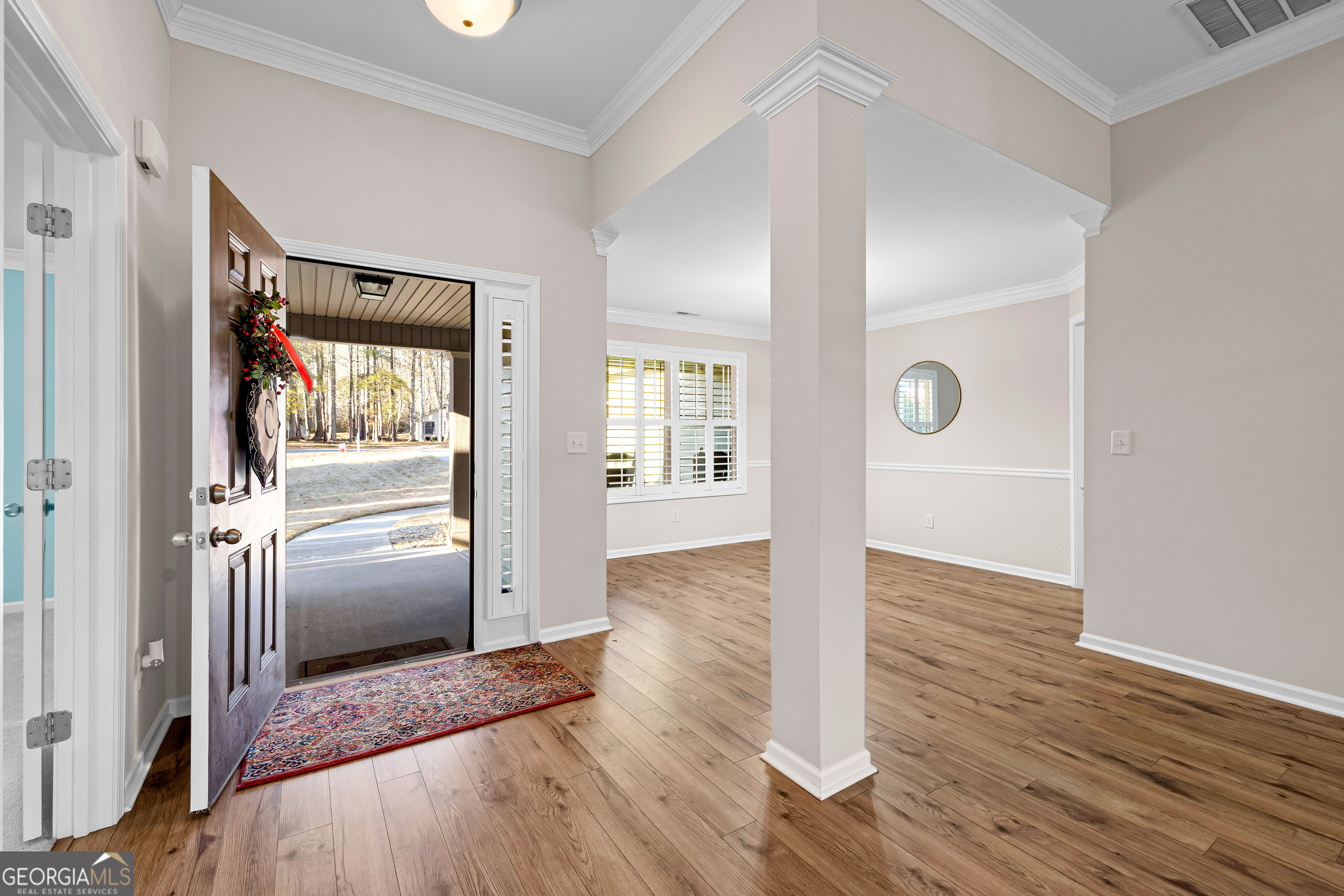 4 Buttonbush Court Newnan, GA 30265 - Photo 5 of 40 a view of a hallway view with wooden floor and staircase