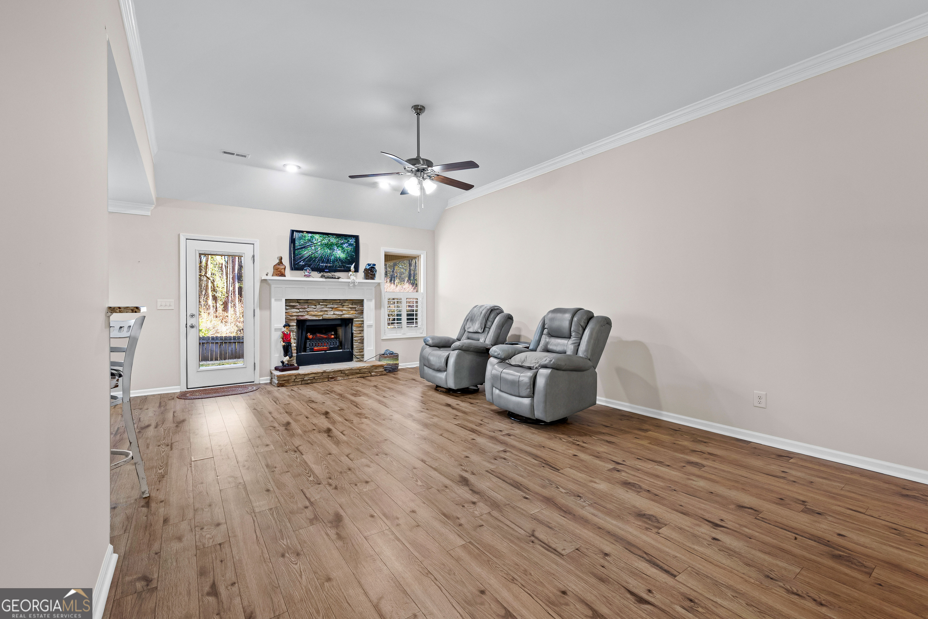 4 Buttonbush Court Newnan, GA 30265 - Photo 8 of 40 a living room with furniture and a fireplace