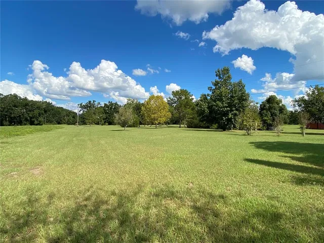 a bedroom with a bed and a mirror