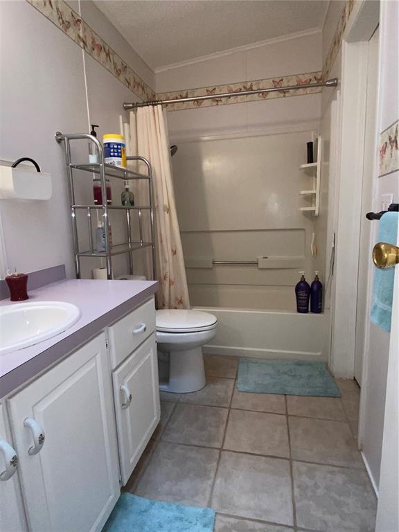 5559 Southwest 42nd Place Bell, FL 32619 - Photo 28 of 48 a bathroom with a sink a toilet and shower