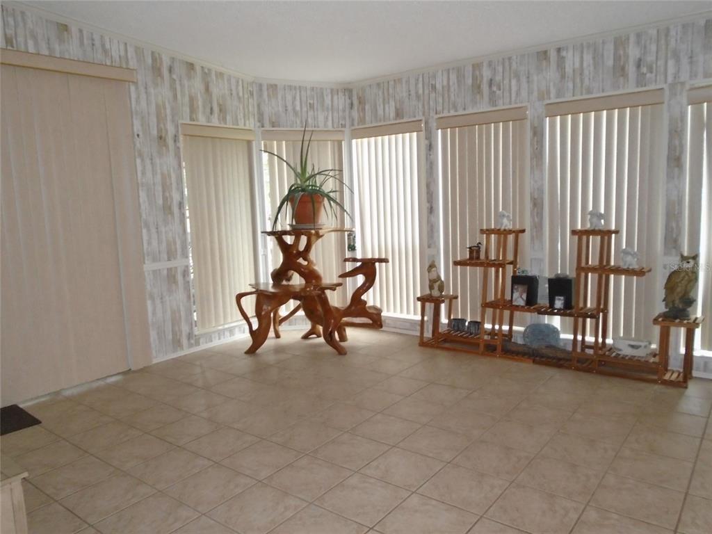 5559 Southwest 42nd Place Bell, FL 32619 - Photo 29 of 48 a view of a room with gym equipment and a large window