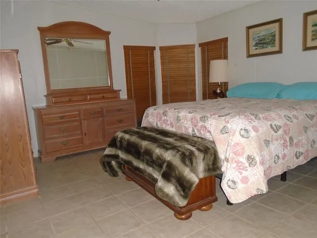 a view of a swimming pool with lawn chairs