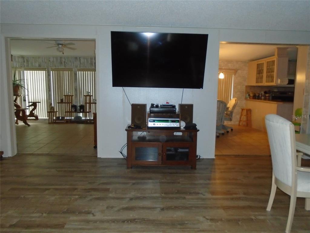 5559 Southwest 42nd Place Bell, FL 32619 - Photo 35 of 48 a living room with furniture and a flat screen tv