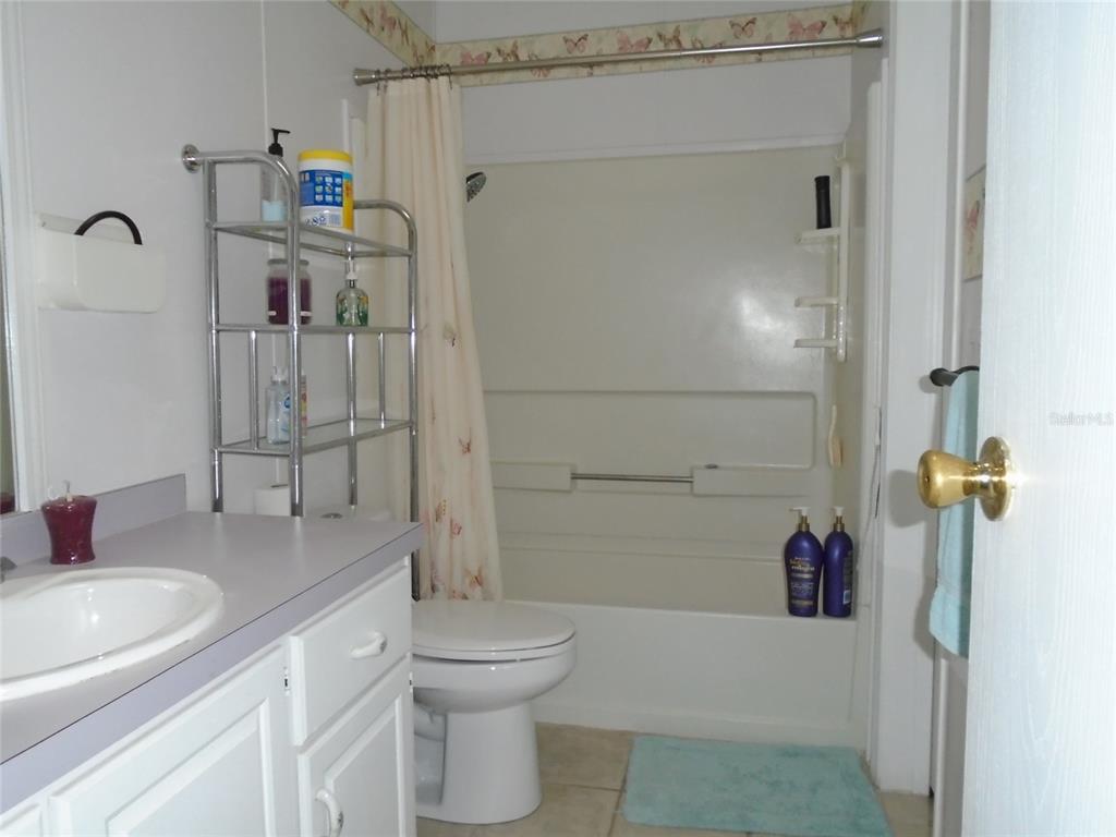 5559 Southwest 42nd Place Bell, FL 32619 - Photo 40 of 48 a bathroom with a sink toilet and shower