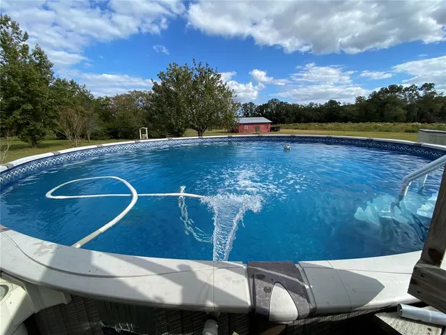 a view of swimming pool with seating