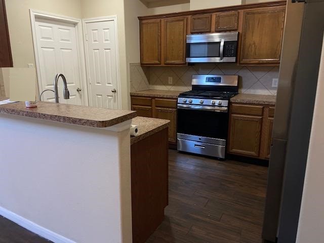 13343 South Point Lane Houston, TX 77034 - Photo 2 of 13 a kitchen with stainless steel appliances a sink and a microwave