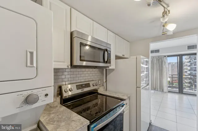 a kitchen with a stove and a microwave