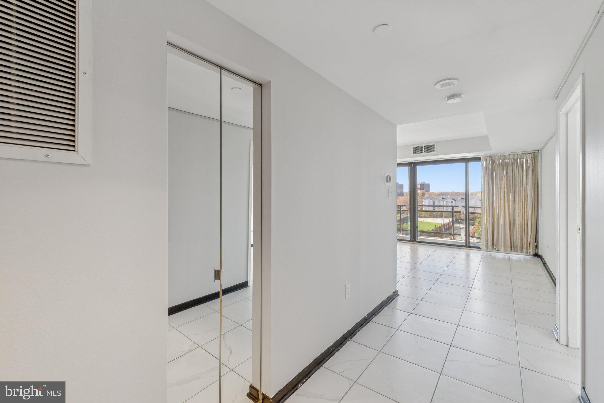 1530 Key Boulevard, Unit 929 Arlington, VA 22209 - Photo 16 of 37 a view of an empty room with a window