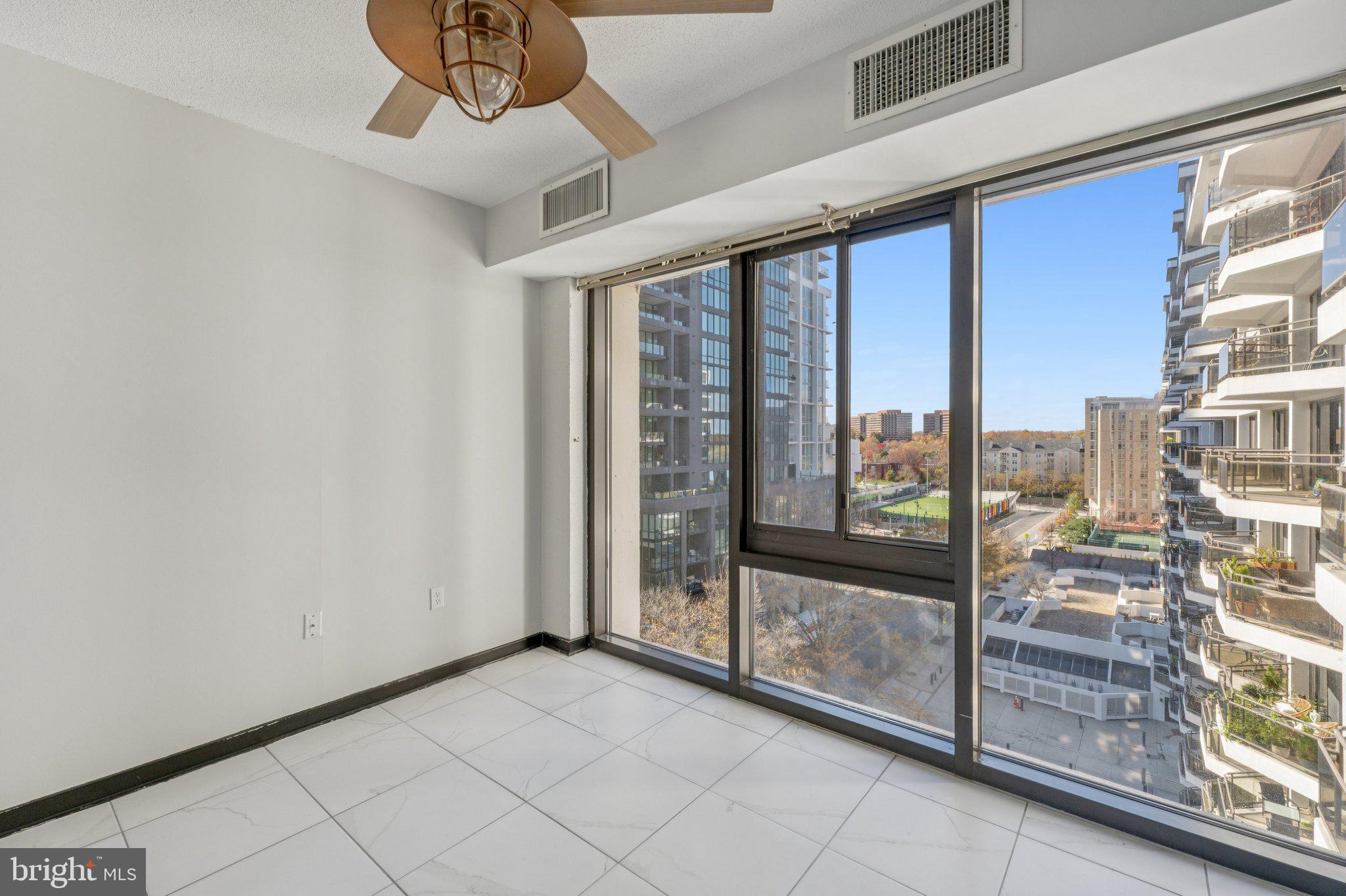 1530 Key Boulevard, Unit 929 Arlington, VA 22209 - Photo 18 of 37 a view of an entryway with a floor to ceiling window
