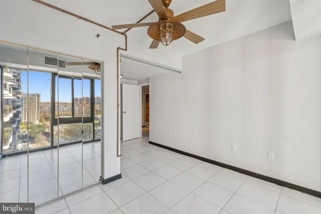 a view of a hallway with closet