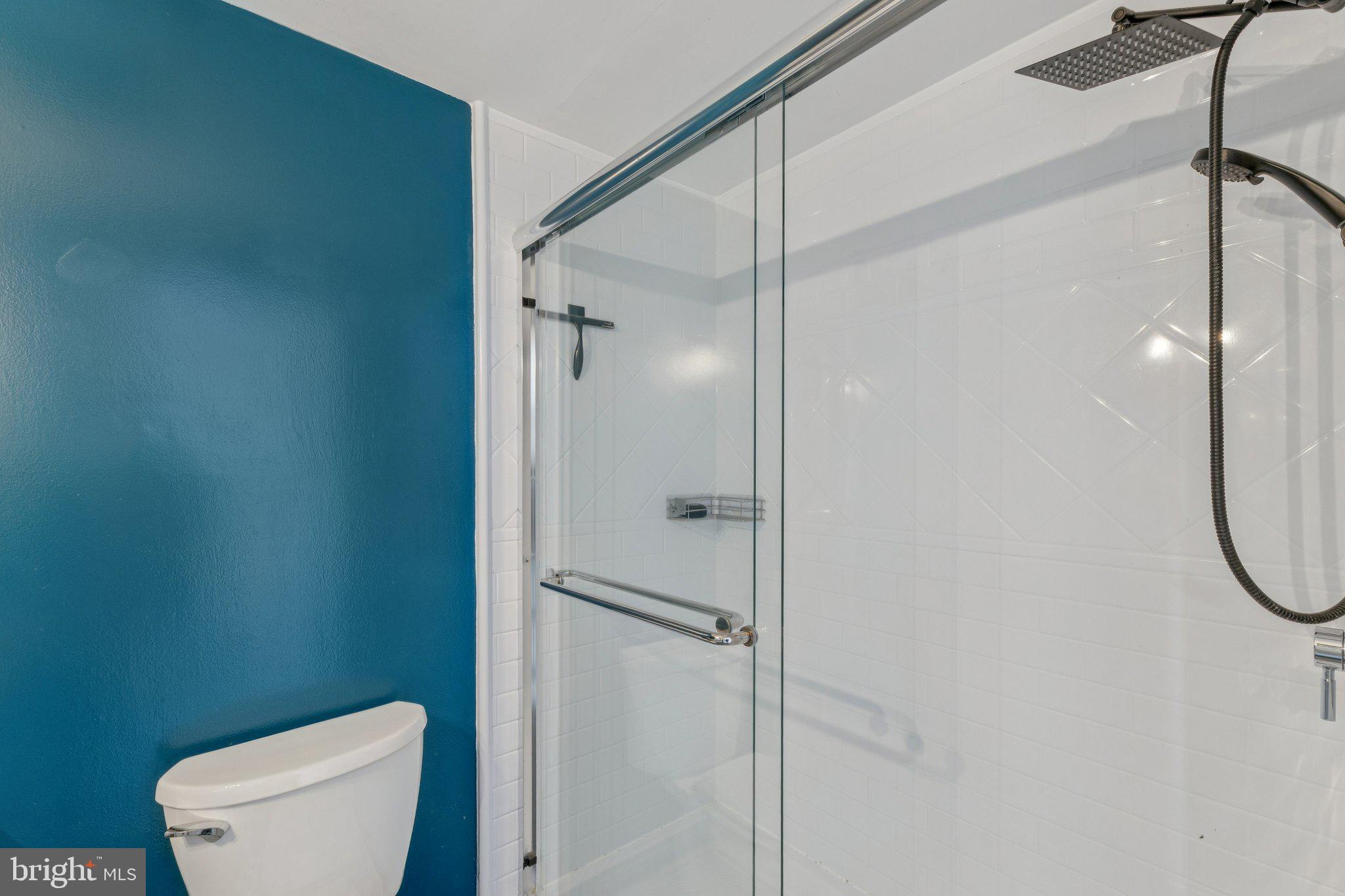 1530 Key Boulevard, Unit 929 Arlington, VA 22209 - Photo 24 of 37 a bathroom with a toilet and a shower