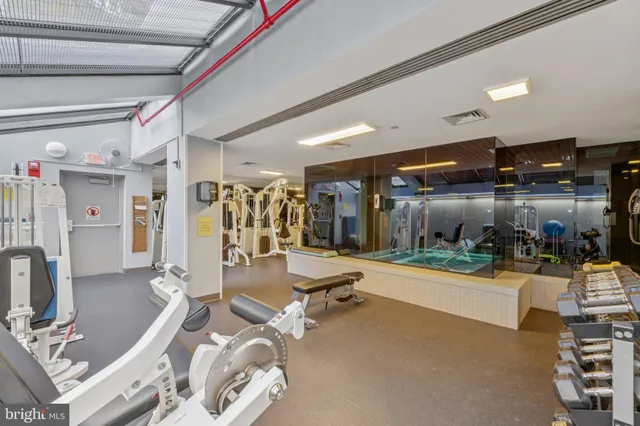 a view of an empty room and wooden floor