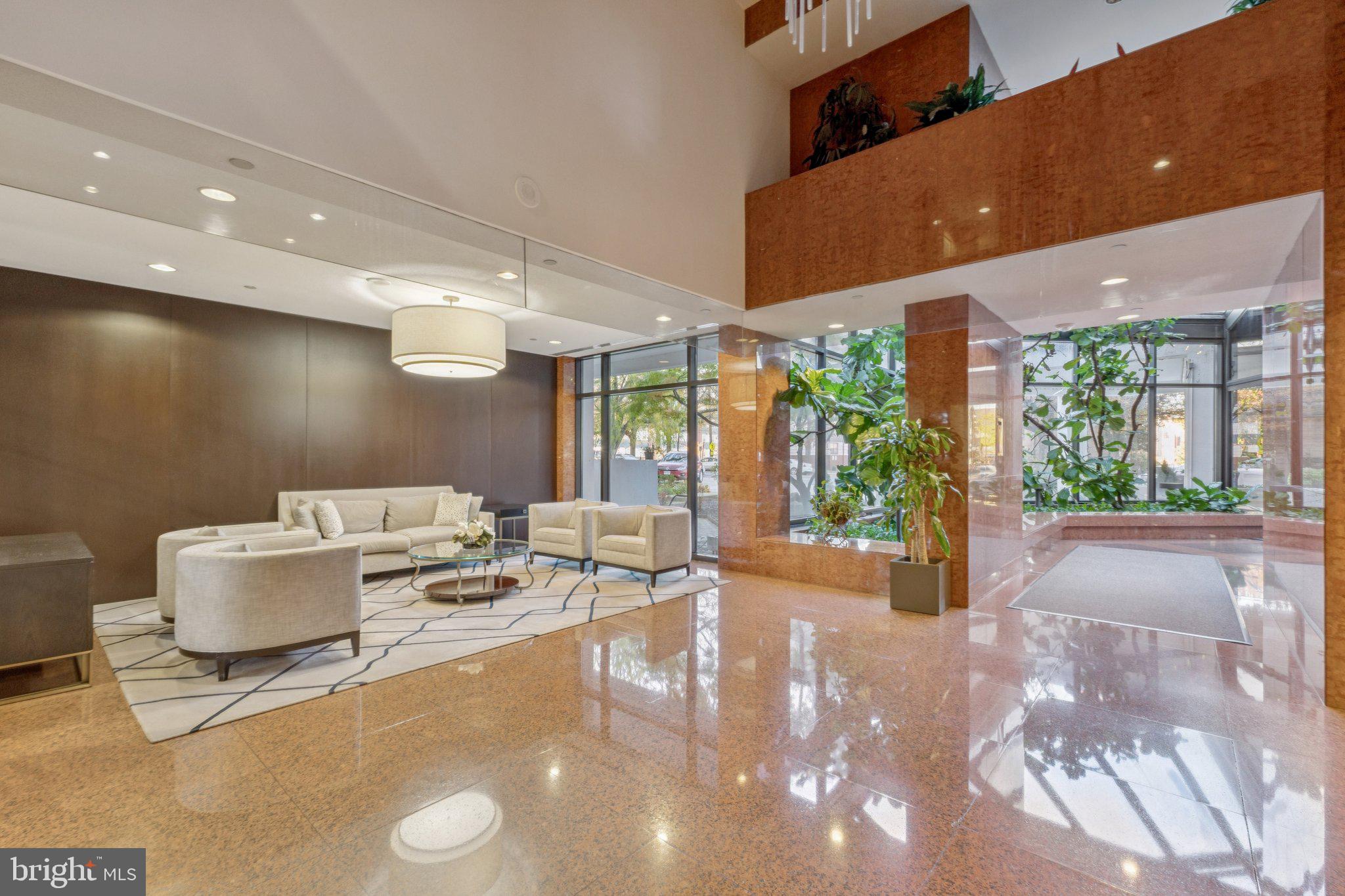 1530 Key Boulevard, Unit 929 Arlington, VA 22209 - Photo 34 of 37 a living room with furniture and a large window