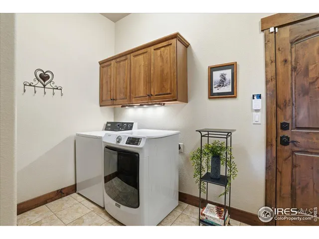 a utility room with sink dryer and washer