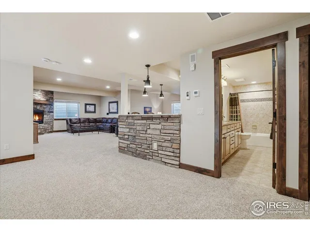 a view of a hallway with seating area