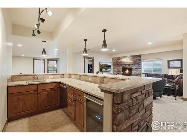a kitchen with stainless steel appliances granite countertop a sink and a stove