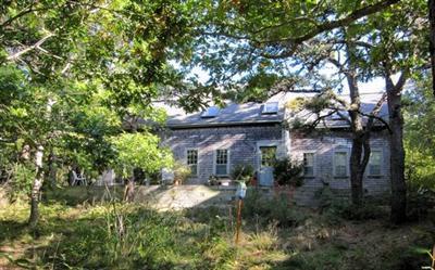 4 Lesser Lane Truro, MA 02666 - Photo 1 of 15 a view of house with tall trees