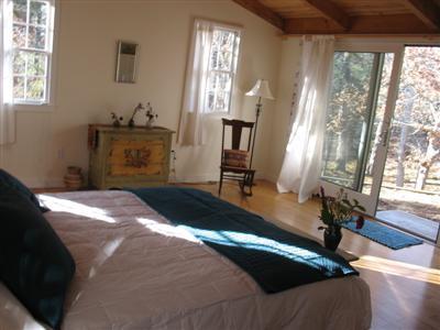 4 Lesser Lane Truro, MA 02666 - Photo 14 of 15 a bedroom with a bed and a window