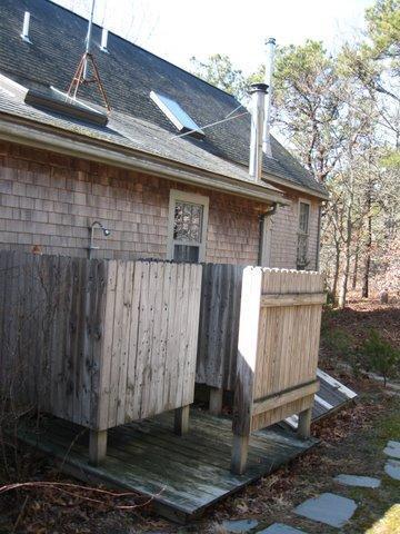 4 Lesser Lane Truro, MA 02666 - Photo 15 of 15 a front view of a house with a yard