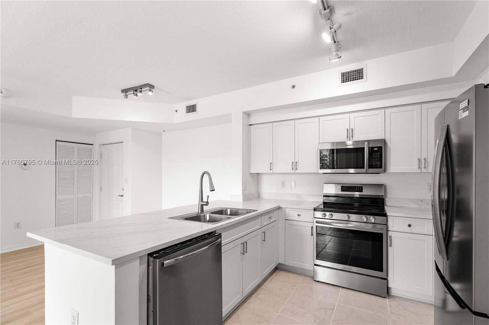 6851 Southwest 44th Street, Unit 107 Miami, FL 33155 - Photo 9 of 26 Images reflect a similar upgraded unit. Finishes are the same, but appliances may vary.