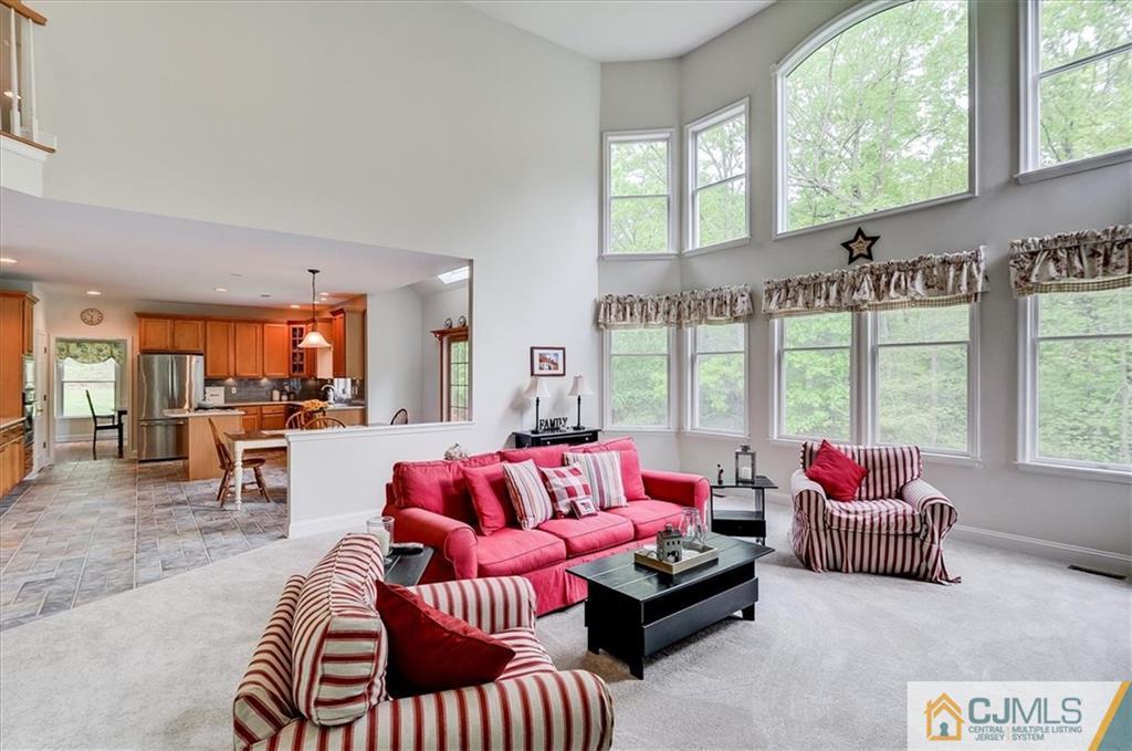76 Bennett Road Old Bridge, NJ 07747 - Photo 12 of 23 a living room with furniture and a floor to ceiling window