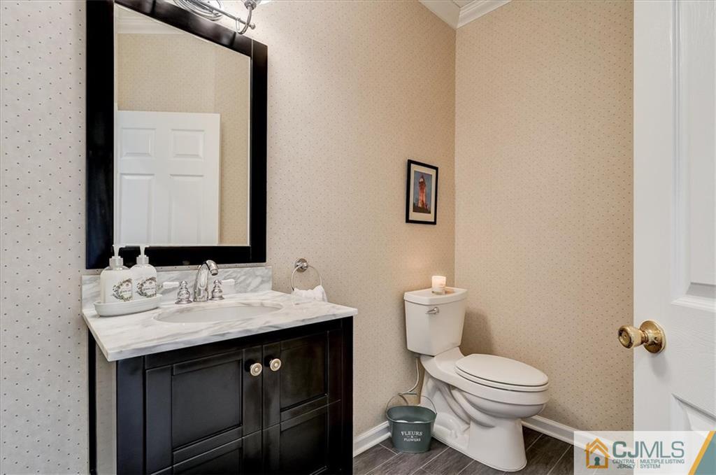 76 Bennett Road Old Bridge, NJ 07747 - Photo 14 of 23 a bathroom with a sink and a toilet