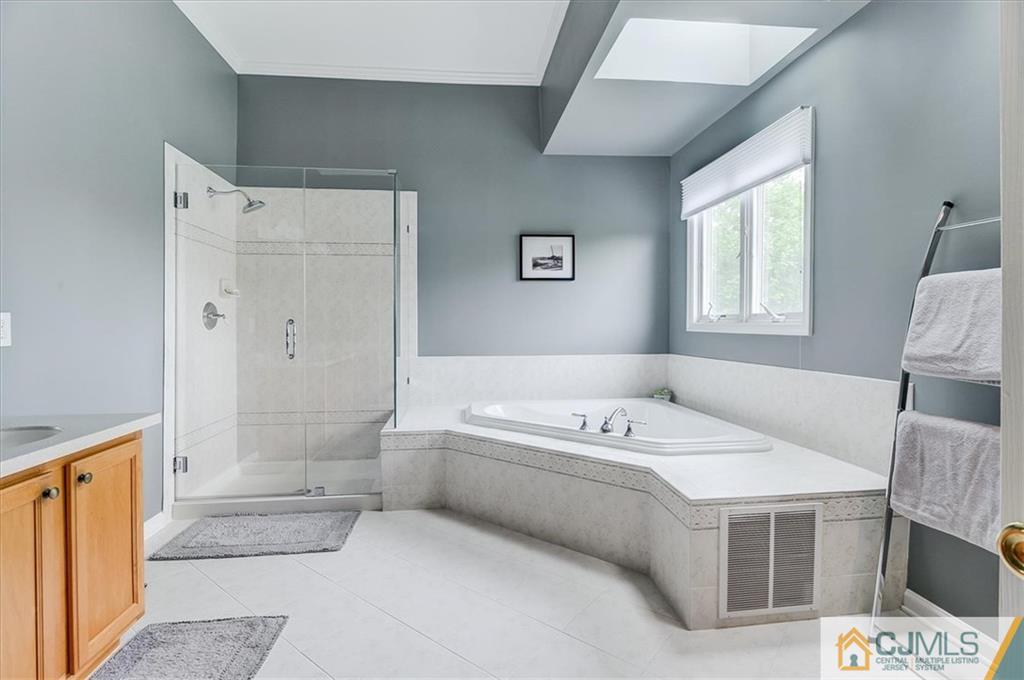 76 Bennett Road Old Bridge, NJ 07747 - Photo 16 of 23 a en suite bathroom with a tub shower and sink