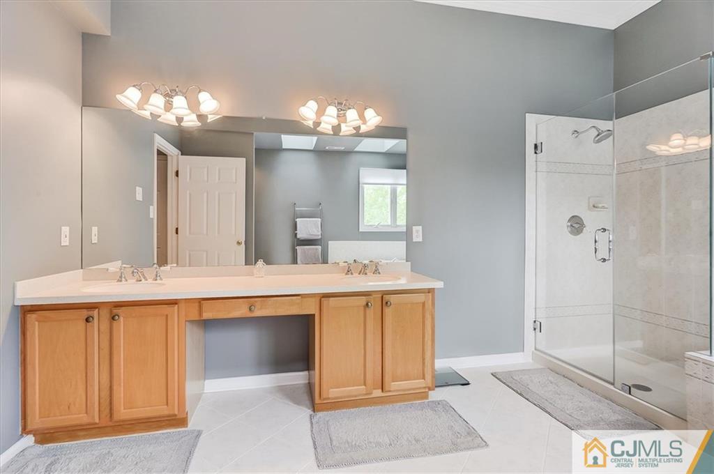 76 Bennett Road Old Bridge, NJ 07747 - Photo 17 of 23 a large bathroom with a sink mirror and a bath tub