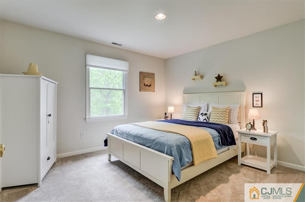 76 Bennett Road Old Bridge, NJ 07747 - Photo 18 of 23 a bed room with a bed and a window