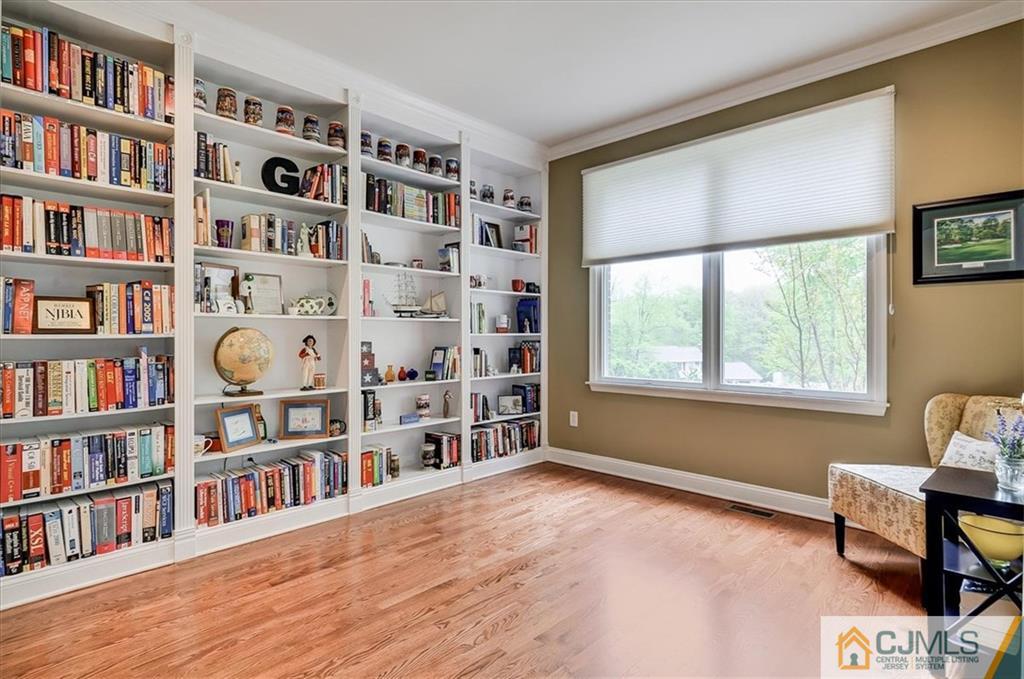 76 Bennett Road Old Bridge, NJ 07747 - Photo 3 of 23 a room with a book shelf and a window