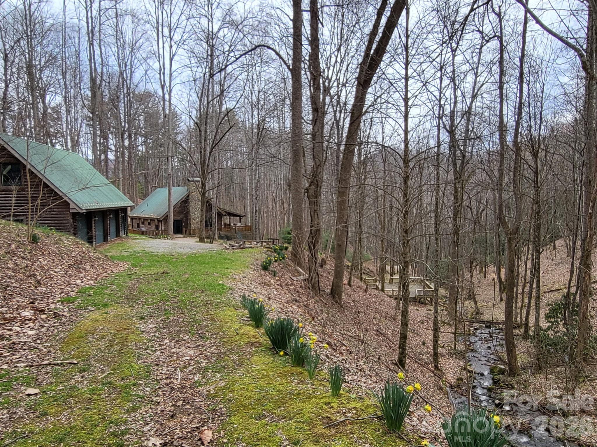 682 Rock House Road Hot Springs, NC 28743 - Photo 7 of 43 a view of house with yard and outdoor seating