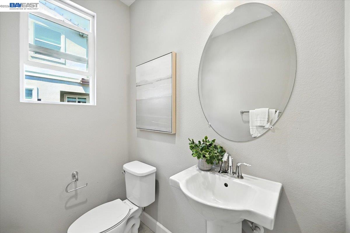 437 Ryan Terrace San Ramon, CA 94583 - Photo 13 of 30 a bathroom with a sink mirror and toilet