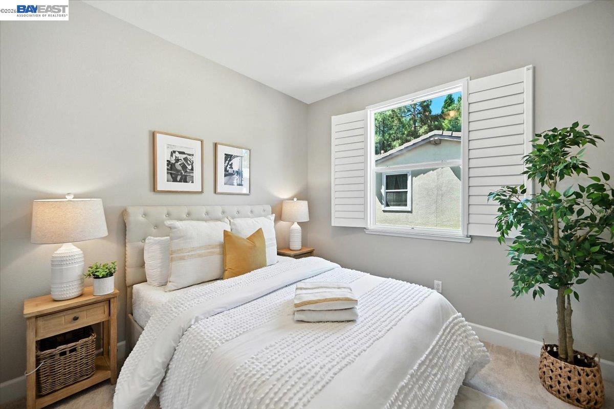 437 Ryan Terrace San Ramon, CA 94583 - Photo 16 of 30 a bedroom with a bed and a potted plant