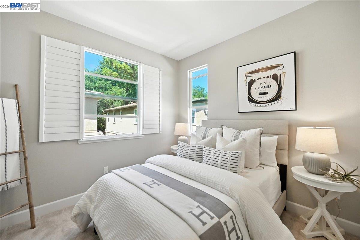 437 Ryan Terrace San Ramon, CA 94583 - Photo 17 of 30 a bedroom with a bed and a lamp on table